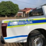 A South African Police Service Visible Policing vehicle parked in a residential street in Pienaar.